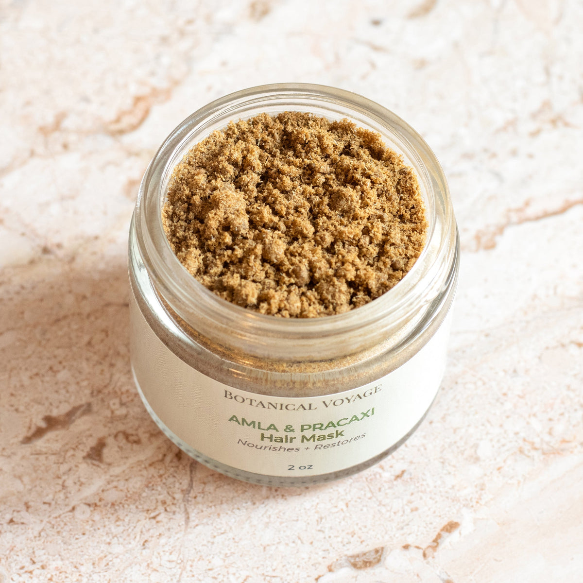 Jar of Botanical Voyage Amla & Pracaxi Hair Mask on a light background.